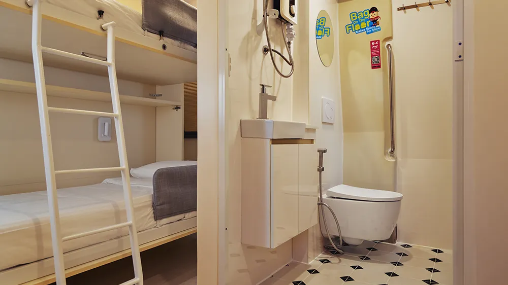 The custom-made beds can be easily folded away when not in use in a hotel created from a converted underground carriage. (Photo)